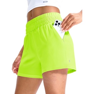 image:imageMIER Running Shorts for Women Quick Dry Mid Waisted Athletic Workout Gym Shorts with Mesh Liner 4 Inch Inseam 3 PocketsNeon Green